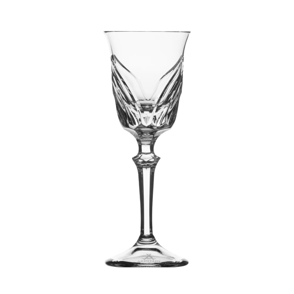 An elegant, slender liqueur glass crafted from clear crystal glass with delicate, wing-like decorations on the bowl. Slender stem with a stylised knot, round base featuring the ARNSTADT KRISTALL logo. Approx. 16 cm high.