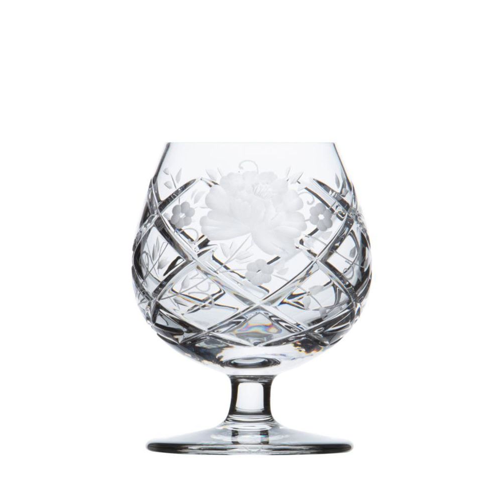 A bulbous crystal cognac glass with a short stem and round base, artfully decorated. The surface features a detailed, frosted floral pattern, surrounded by a diagonal lattice pattern that reflects light.